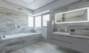 Modernos baños con bañera, lavabo y espejo iluminado. Inspiración para tus ideas baños.