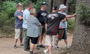Undercover cops at festivals blend in with the crowd. One officer's concealed firearm is visible in a red circle.