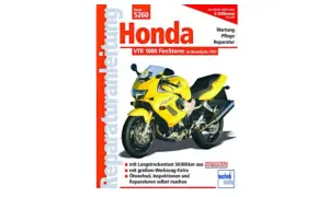 Żółty motocykl Honda VTR 1000 Firestorm na okładce instrukcji napraw.