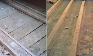 Drewniane belki na starej podłodze, być może z resztkami eternitu. Remont trwa.