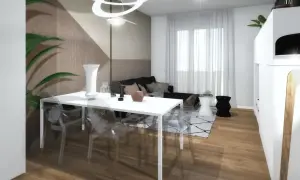 La parete dietro tavolo da pranzo presenta un motivo geometrico in tonalità neutre.