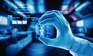 Rękawiczka laboratoryjna trzyma model DNA, symbolizując przełomowe esaliens medycyny i nowych technologii.