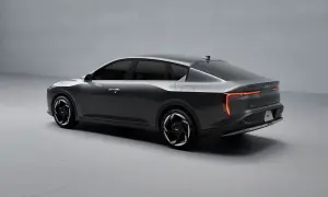 Nowoczesny kia sedan w kolorze grafitowym, z futurystycznymi światłami LED i aerodynamiczną sylwetką.