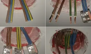 Instalacja elektryczna bezpuszkowa: przewody brązowe, niebieskie i żółto-zielone połączone w kostkach.