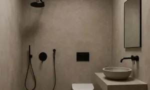 Baño moderno con paredes de microcemento, ducha negra, lavabo de piedra y espejo.
