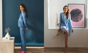 Kobieta w niebieskim garniturze, zastanawia się jakie buty do niebieskiego garnituru wybrać: różowe szpilki lub eleganckie sandałki.