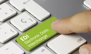 Palec naciska zielony klawisz z napisem EDI Electronic Data Interchange. To skrót od Electronic Data Interchange, czyli elektronicznej wymiany danych.