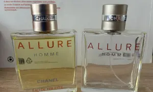 Dwa flakony perfum Chanel Allure Homme. Jeden pełny, drugi prawie pusty. Klasyczny zapach, który dodaje pewności siebie.