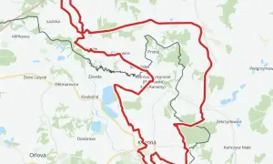 Mapa z zaznaczonym czerwonym szlakiem rowerowym, biegnącym przez tereny przygraniczne Polski i Czech, w okolicach Jastrzębia-Zdroju i Karwiny.