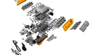 Rozłożony silnik Hellcat z pomarańczowymi elementami i napisem "SUPERCHARGED HEMI".