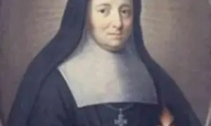 Portret zakonnicy w czarnym habicie i białym gorsecie. W dłoni trzyma płonące serce. Święto św. Klary z Asyżu obchodzone jest 11 sierpnia, ale jej wspomnienie liturgiczne przypada na 12 sierpnia.