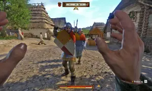Gracz w Kingdom Come Deliverance, w środku wioski, przygotowuje się do walki. Widok z pierwszej osoby, jakbyś szukał kingdom come deliverance solucja.