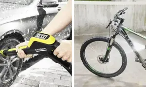 Mycie roweru na myjni Karcher. Woda spływa po ramie, kołach i widelcu, usuwając brud.
