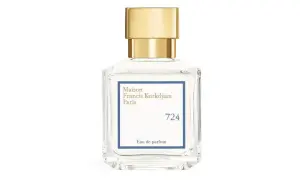 Elegancka butelka perfum Maison Francis Kurkdjian 724 z złotą nakrętką.