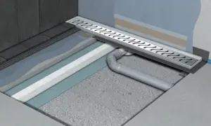 Przekrój instalacji prysznicowej bez brodzika. Widoczny system odpływowy i warstwy podłogi.