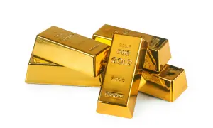 Lingotes de oro brillante apilados. El oro se utiliza para inversión, joyería y como reserva de valor.