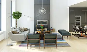 Nowoczesny salon z kominkiem i kuchnią. Styl wykończenia wnętrz to połączenie minimalizmu i elegancji.