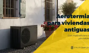 Unidad exterior de aerotermia junto a una casa antigua. ¿Son viables las mentiras de la aerotermia en viviendas antiguas con mala eficiencia?