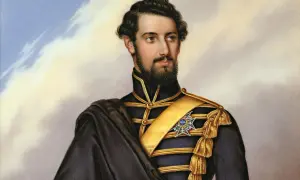 Porträtt av Karl XV i mörk uniform med gulddekorationer och en blå medalj.