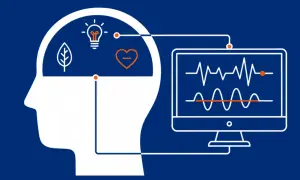 Grafika ilustruje, jak neurofeedback co to jest: połączenie mózgu z monitorem pokazującym fale mózgowe, symbolizujące myśli i emocje.