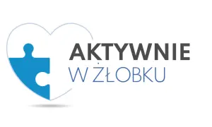 Niebieski element puzzla w kształcie serca z napisem "AKTYWNIE W ŻŁOBKU" symbolizuje rozwój i zabawę najmłodszych.