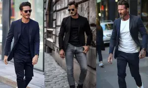 Drei Männer in stilvollen Outfits: dunkelblauer Blazer über schwarzem Pullover, schwarzer Blazer über schwarzem Pullover und grauer Jeans, dunkelblauer Blazer über weißem Pullover.