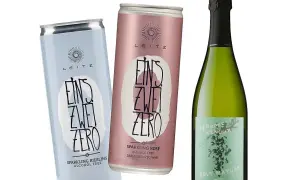 Två burkar alkoholfritt mousserande vin och en flaska vin. Perfekt vin till lax, oavsett om du väljer Riesling eller Rosé.
