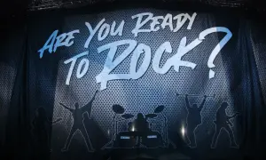 Scorpions w Krakowie gotowi do rocka! Napis "Are You Ready To Rock?" i sylwetki muzyków na scenie.