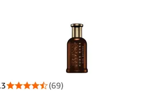 Elegancka butelka perfum Hugo Boss Oud Saffron o bogatym, brązowym odcieniu.