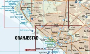 Mapa pokazuje, gdzie jest Aruba, z zaznaczonymi plażami jak Druif Beach i Bushiri Beach, oraz miastem Oranjestad.