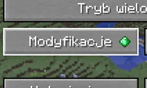 Przycisk "Modyfikacje" w grze Minecraft z zielonym szmaragdem.