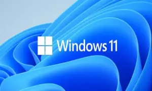 Logo de Windows 11 sobre fondo azul ondulado. Averigua cuanto cuesta instalar Windows 11 y renueva tu sistema.
