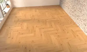 Suelo de madera con disposición en espiga, creando un patrón clásico y elegante.