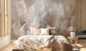 Eleganckie aranżacje sypialni z tapetą w liście paproci tworzą przytulną atmosferę. Miękkie tekstylia i naturalne materiały dopełniają całość.