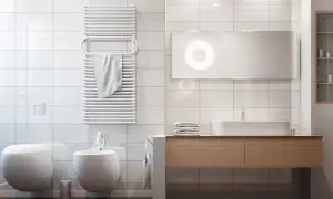 Bagno moderno con termoarredo bianco a parete, ideale per capire dove posizionare termoarredo bagno per asciugare gli asciugamani.