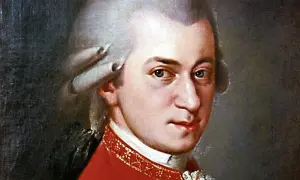 Portret Wolfganga Amadeusza Mozarta w czerwonym stroju z peruką.