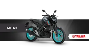 Szary motocykl Yamaha MT-125 z turkusowymi felgami na czarnym tle.