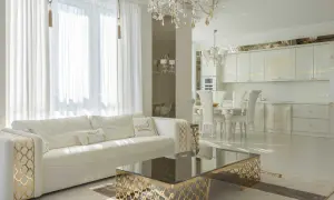 Elegancki salon i kuchnia w stylu glamour, z białymi meblami, złotymi zdobieniami i kryształowym żyrandolem.