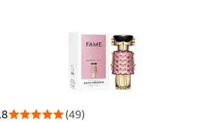 Paco Rabanne Fame Blooming Pink – złoty flakonik perfum w kształcie robota z różowymi łuskami i czarnymi okularami, obok pudełko.
