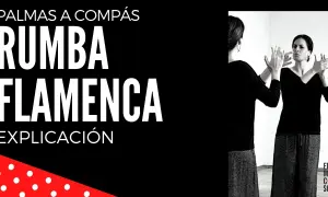 Una mujer practica cómo bailar rumba flamenca frente a un espejo, con las palmas de las manos levantadas.