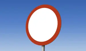 Puste białe koło z czerwoną obwódką na niebieskim tle. Znak drogowy informuje o zakazie ruchu w obu kierunkach.