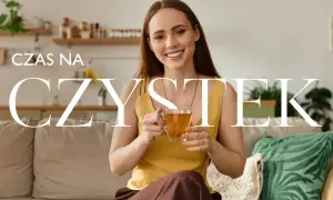 Uśmiechnięta kobieta w ciąży pije herbatę. Czas na czystek, naturalne wsparcie dla mamy i dziecka.