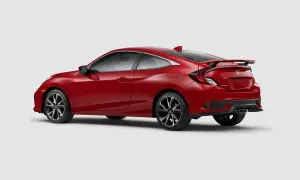 Czerwony Honda Civic Si coupe z czarnym spojlerem i felgami, gotowy do dynamicznej jazdy.
