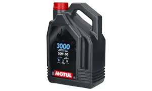 Czarny kanister z czerwonym korkiem, zawierający olej silnikowy Motul 3000 20W-50.