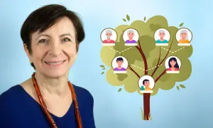 Une femme souriante à côté d'un arbre généalogique illustré.