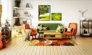 Un salon moderne et chaleureux avec un canapé vert, des fauteuils orange, un tapis coloré et des tableaux de nature. Une belle deco salon.