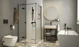 Nowoczesna łazienka z wanną, prysznicem i umywalką. Zastanawiasz się, bidet co to? To urządzenie do higieny intymnej, które może być osobnym elementem lub funkcją toalety.
