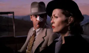 Jack Nicholson z plastrem na nosie i papierosem w ustach, obok Faye Dunaway w kapeluszu. Scena z jednego z filmów Romana Polańskiego.