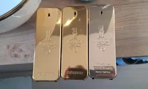 Trzy flakoniki perfum Paco Rabanne 1 Million 100ml w złotych i srebrnych odcieniach.