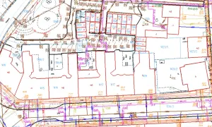 Plan zagospodarowania przestrzennego z zaznaczonymi działkami, budynkami i infrastrukturą.